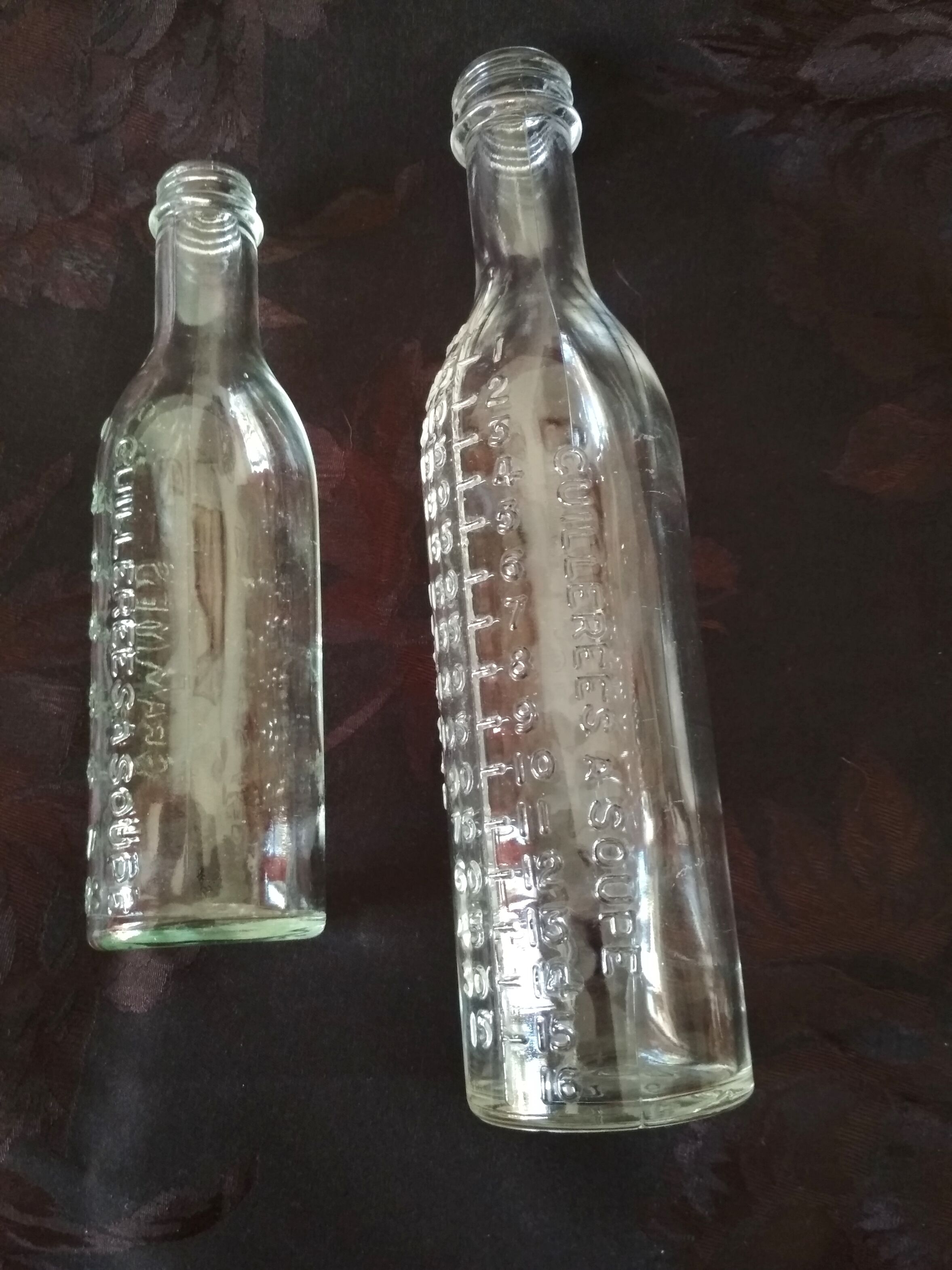 2 old graduated pharmacy bottles
