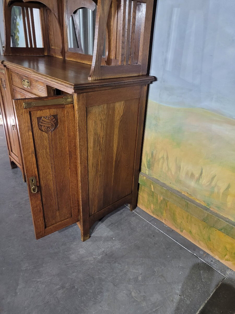 Glass-fronted oak sideboard from the Art Nouveau period.