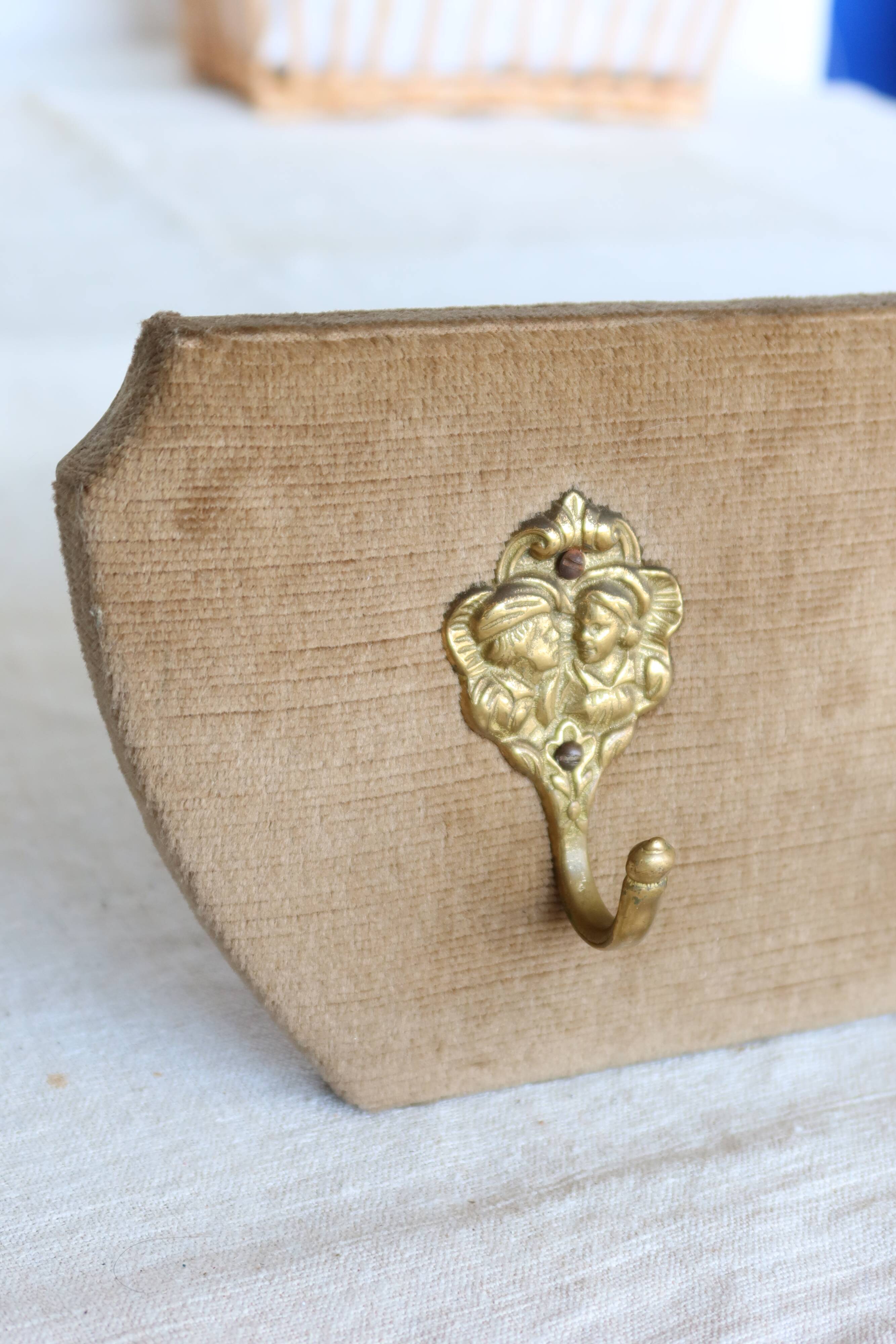 Vintage velvet coat rack with brass hooks