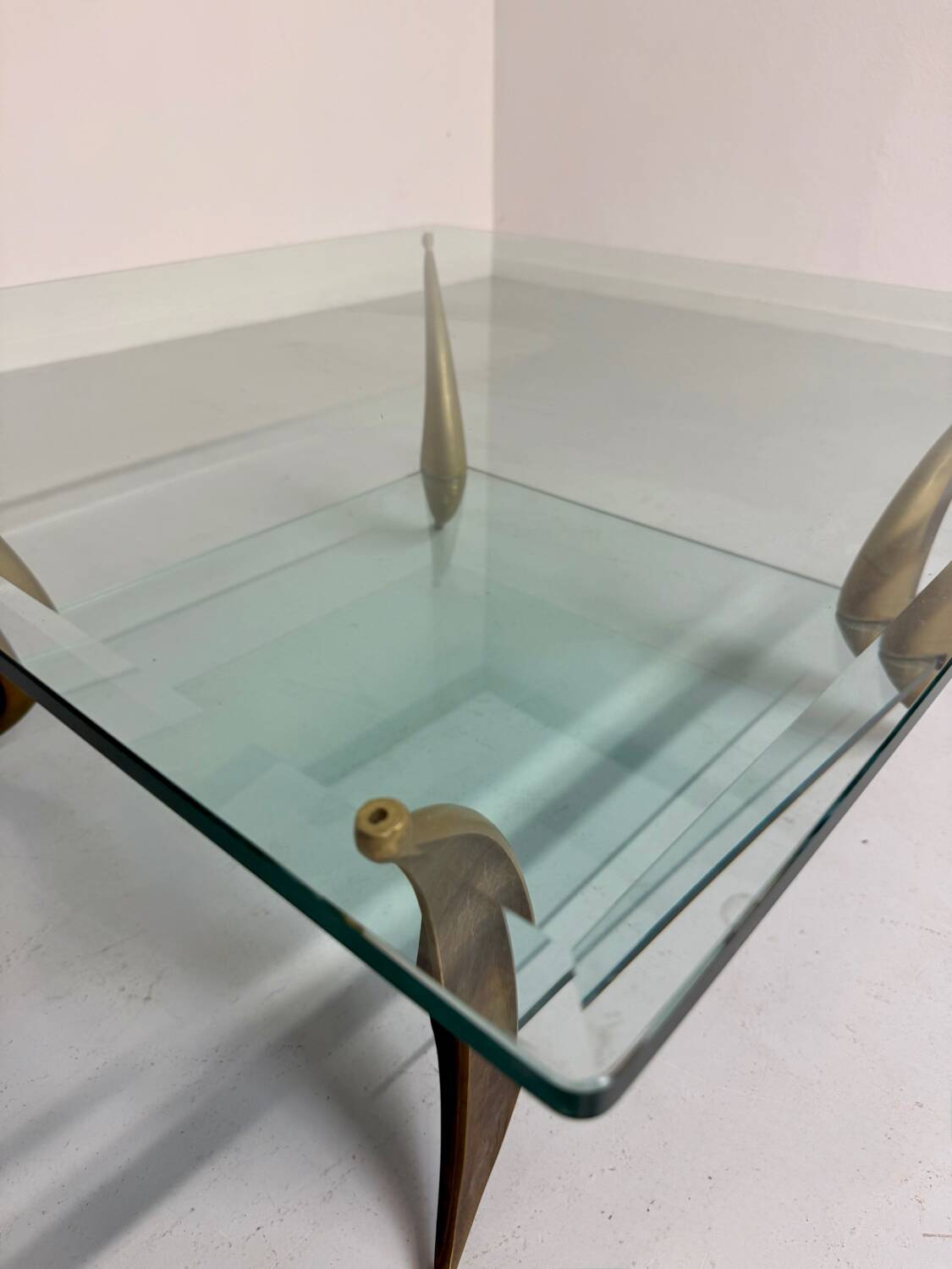 Glass coffee table with solid brass legs, Italian design from the 60s
