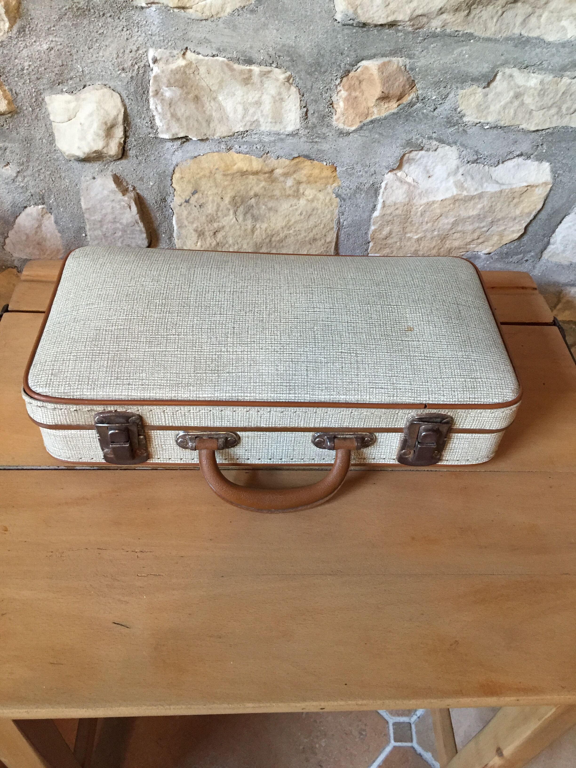 Old set of wooden balls in his suitcase
