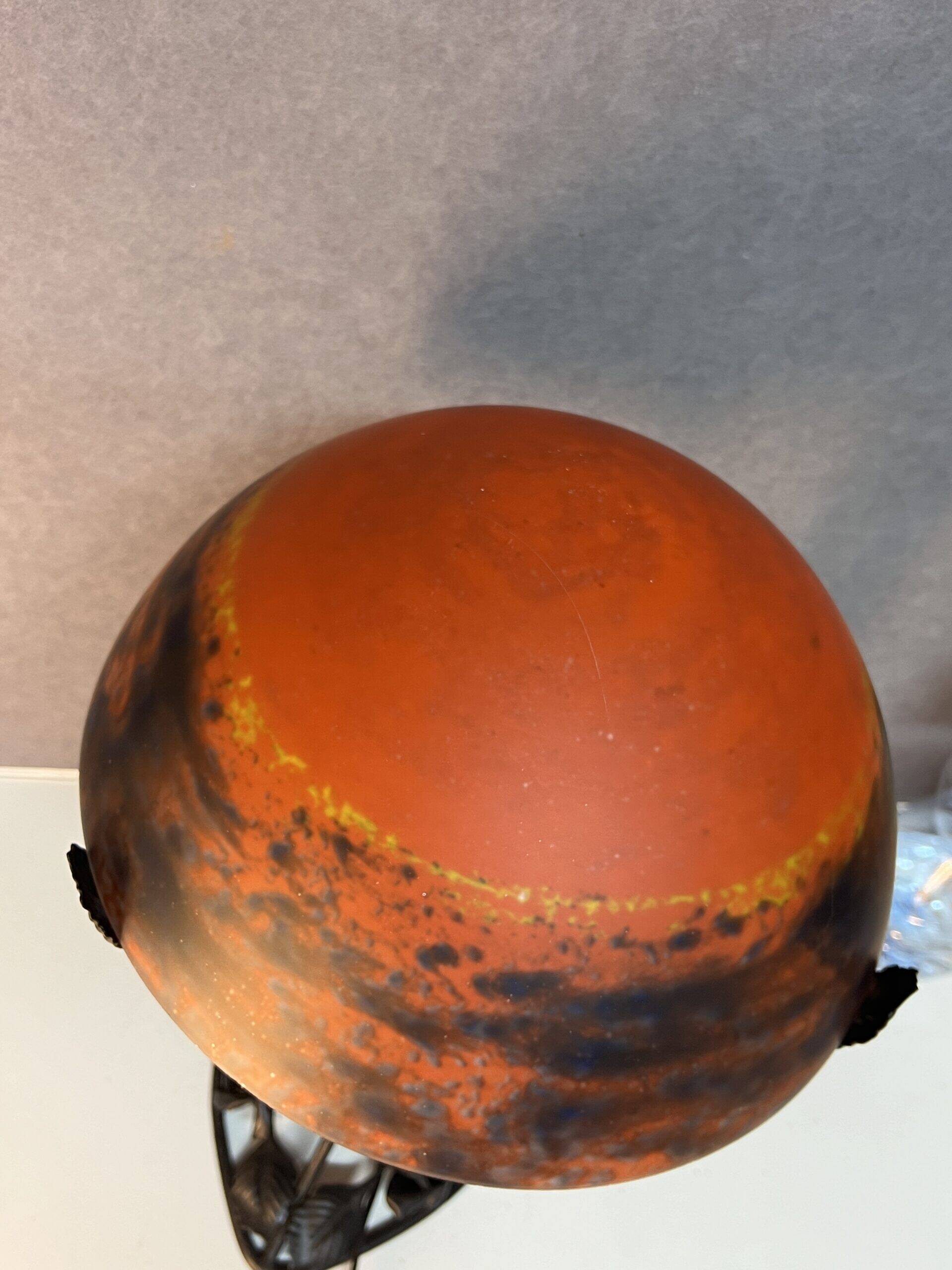 Contemporary mushroom lamp, wrought iron base and shaded orange glass shell