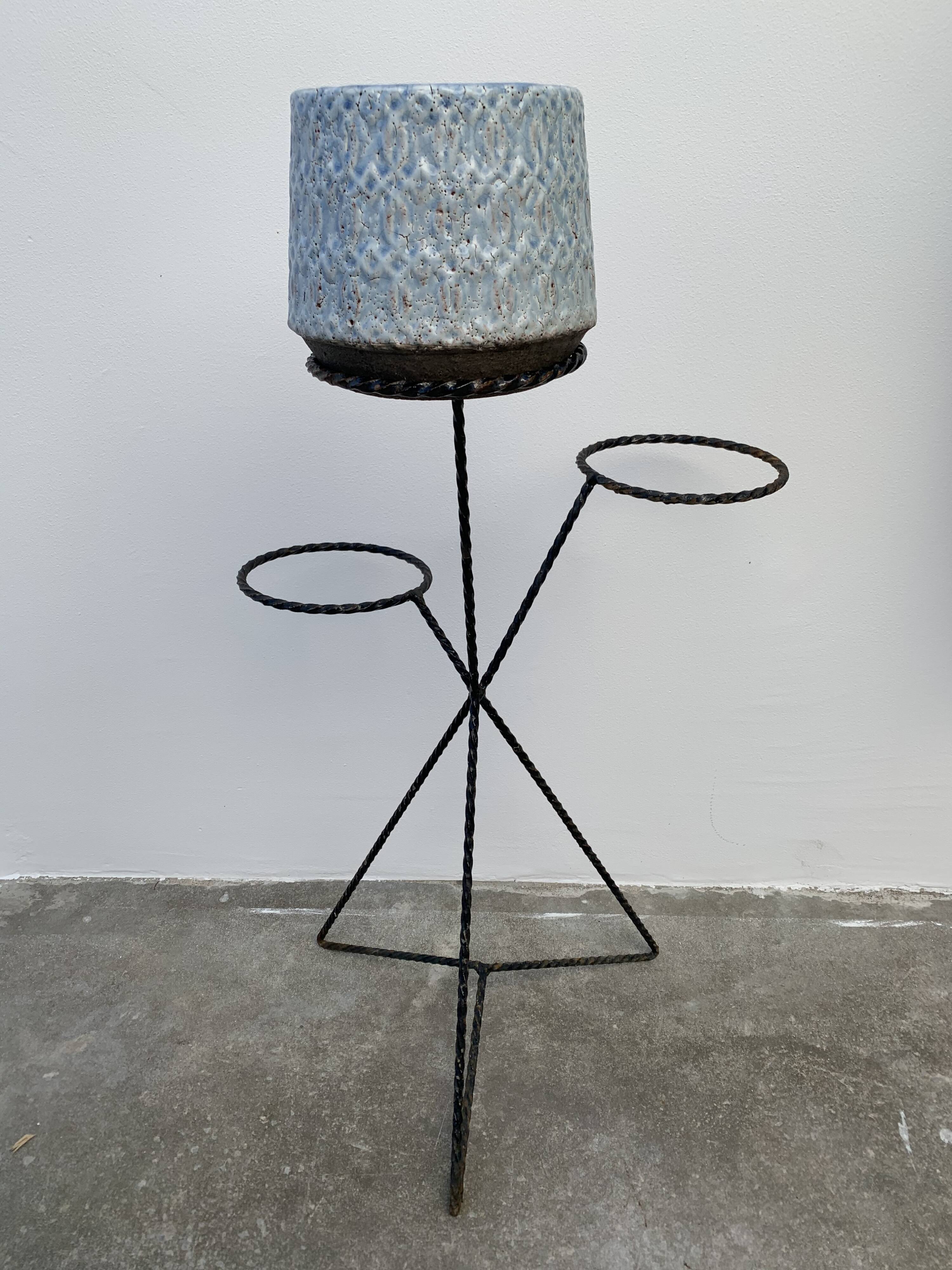 Black metal tripod plant holder