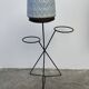 Black metal tripod plant holder