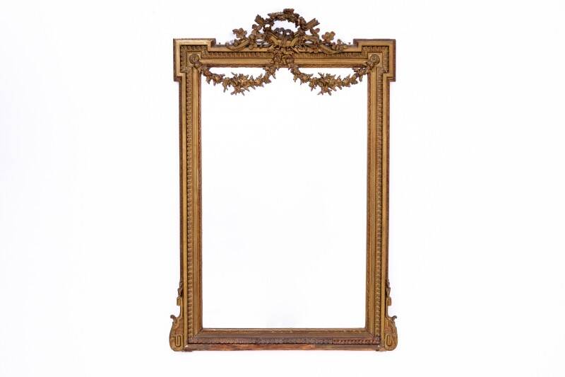Large mirror in a gold frame, France.