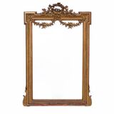 Large mirror in a gold frame, France.