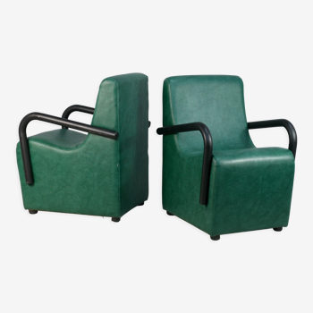 Pair of armrest heaters. Steel and green imitation leather. France, circa 1980
