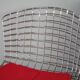 Tabouret de bar Harry Bertoia Knoll chromé galette rouge