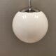 White hanging lamp with metal suspension, made with ball round opal glass shade.