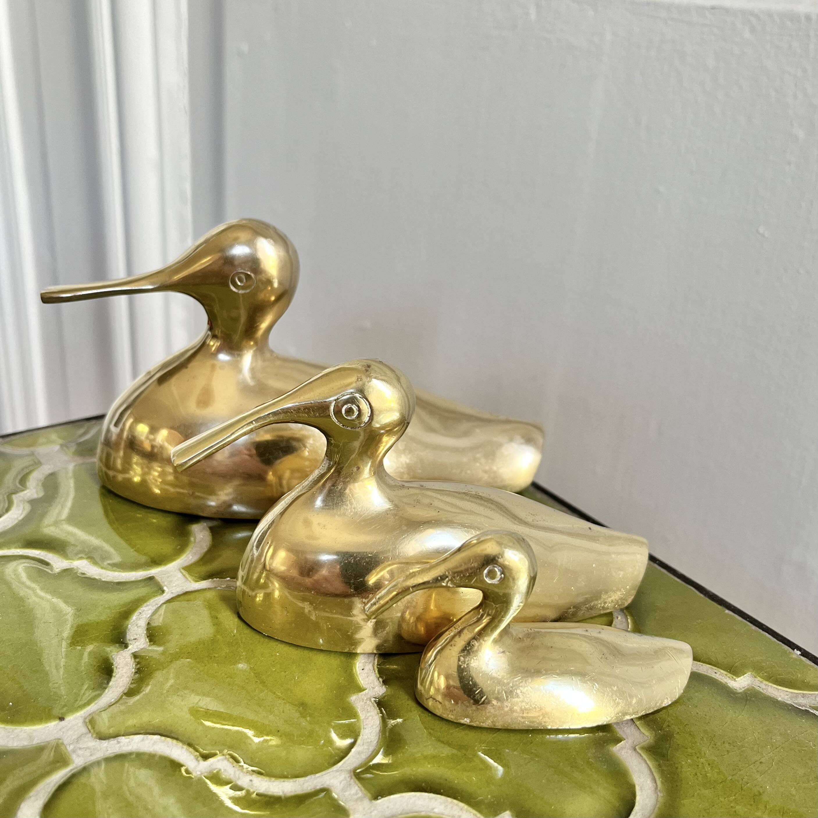 Three brass ducks from the 1950s