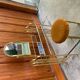 Vintage brown brass dressing table with mirror and matching stool, 1950s - set of 2
