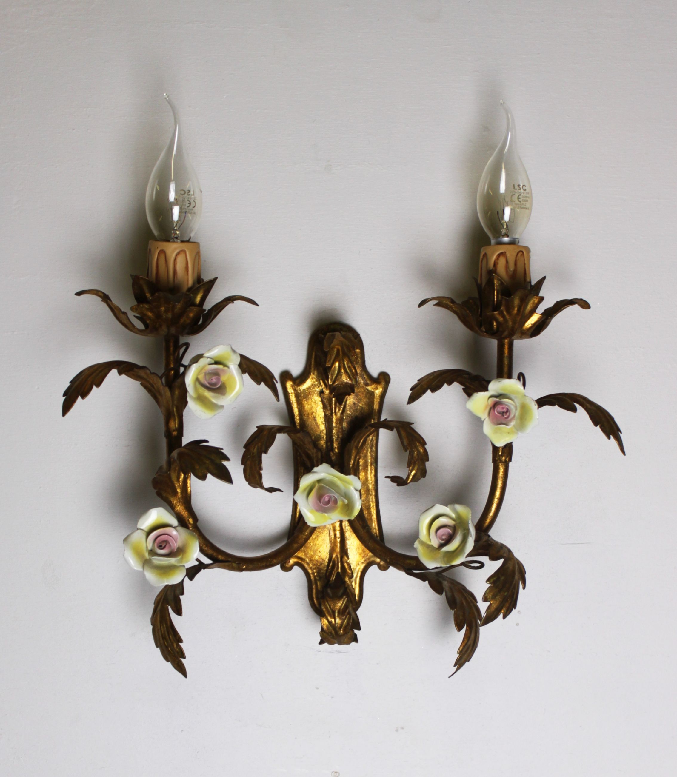 Pair of gold wall sconces with porcelain flowers