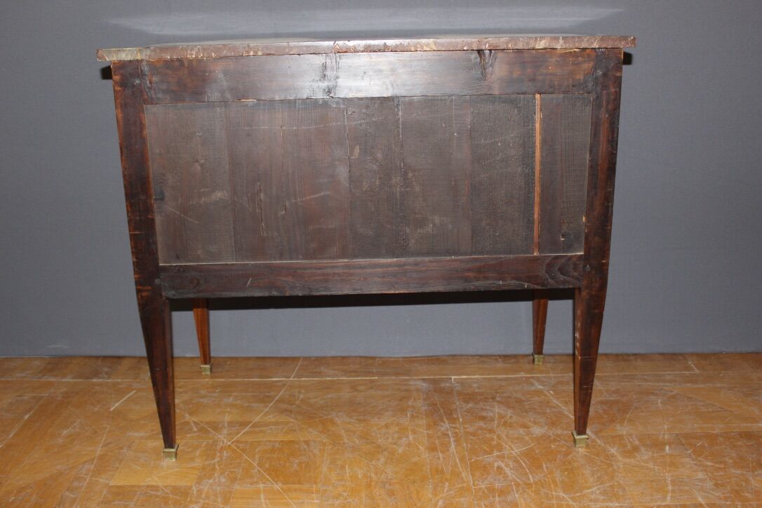 Louis XVI style chest of drawers with music attributes