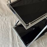 Modernist serving trolley in chromed metal and black smoked glass