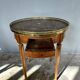 Hot water bottle table with a marble top and a brass gallery.