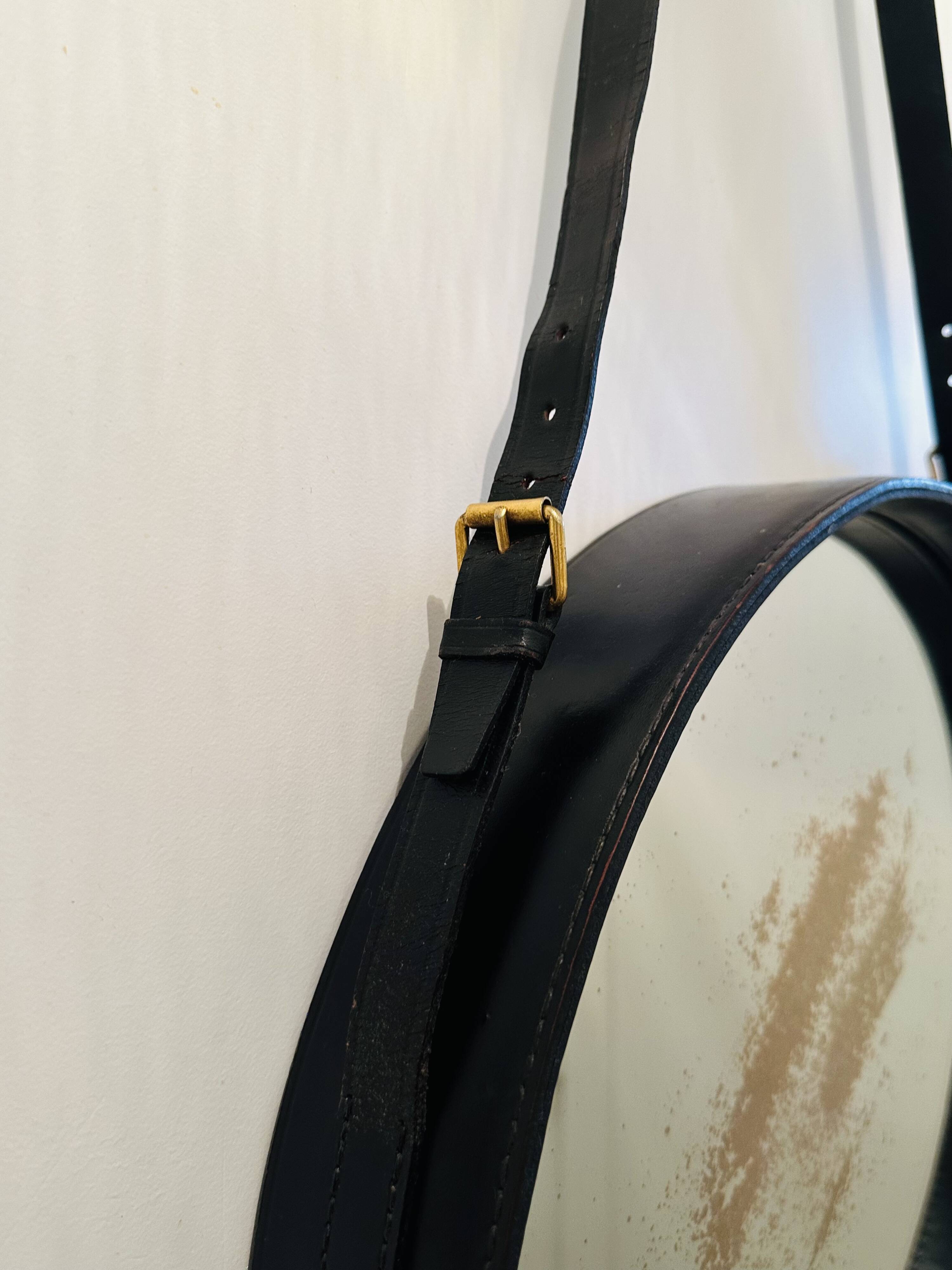 Jacques Adnet pair of circular leather and brass mirrors