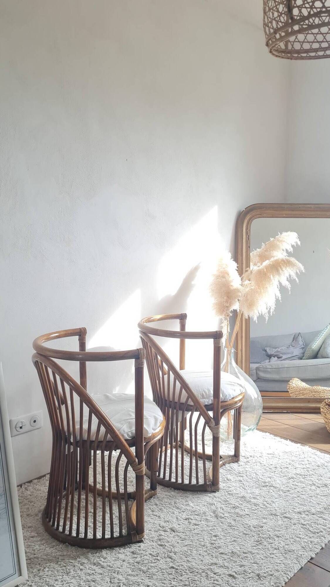 Pair of vintage rattan armchairs circa the 1960s.