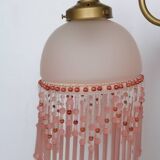 Pink glass wall lamp with garland of pearls