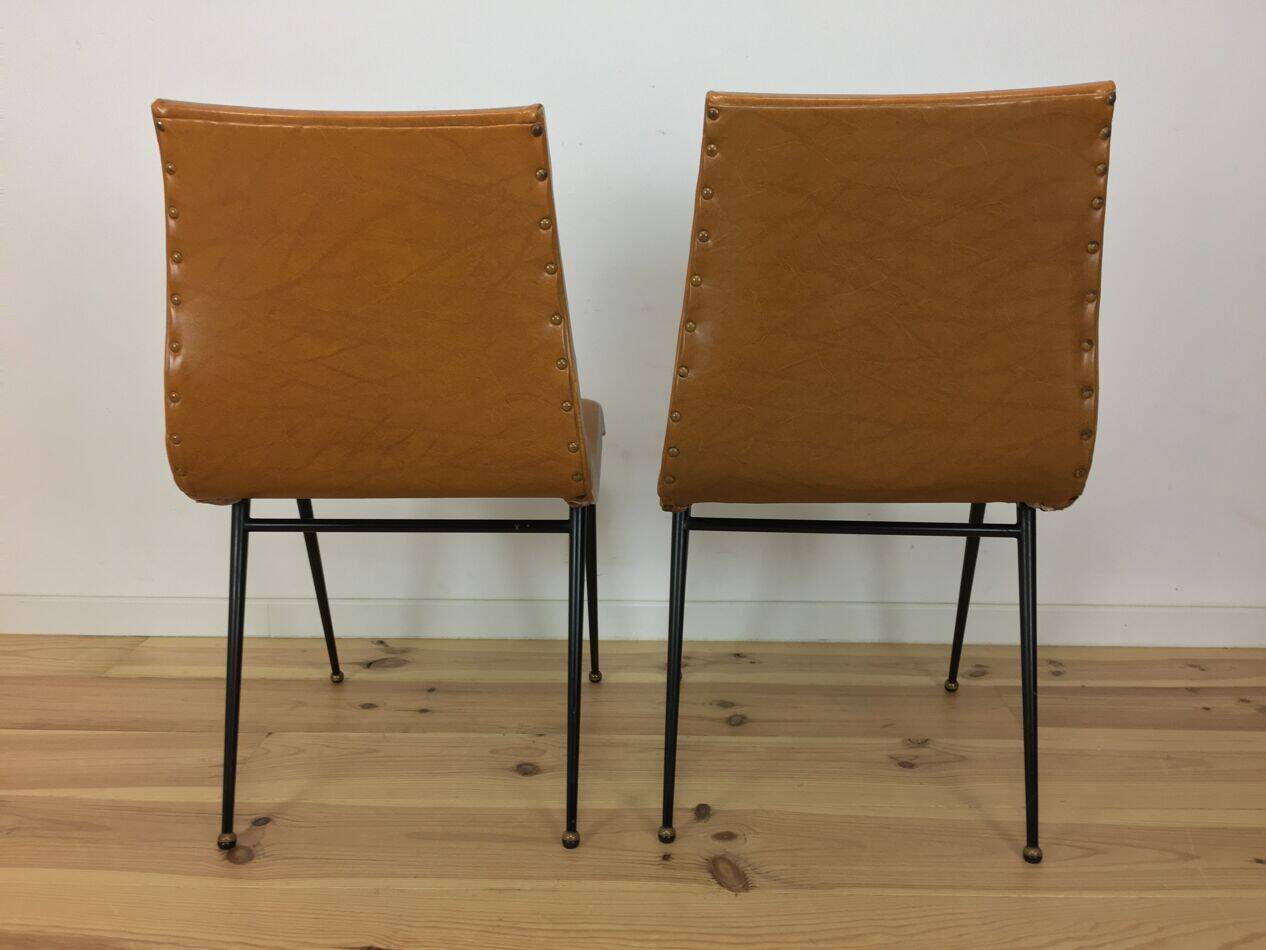 Pair of 1950s chairs with compass legs and brown faux leather.