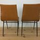 Pair of 1950s chairs with compass legs and brown faux leather.