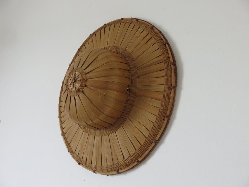Colonial hat in bamboo and braided rattan, wall decoration