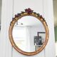 Miroir en bois doré avec fleurs