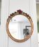 Miroir en bois doré avec fleurs
