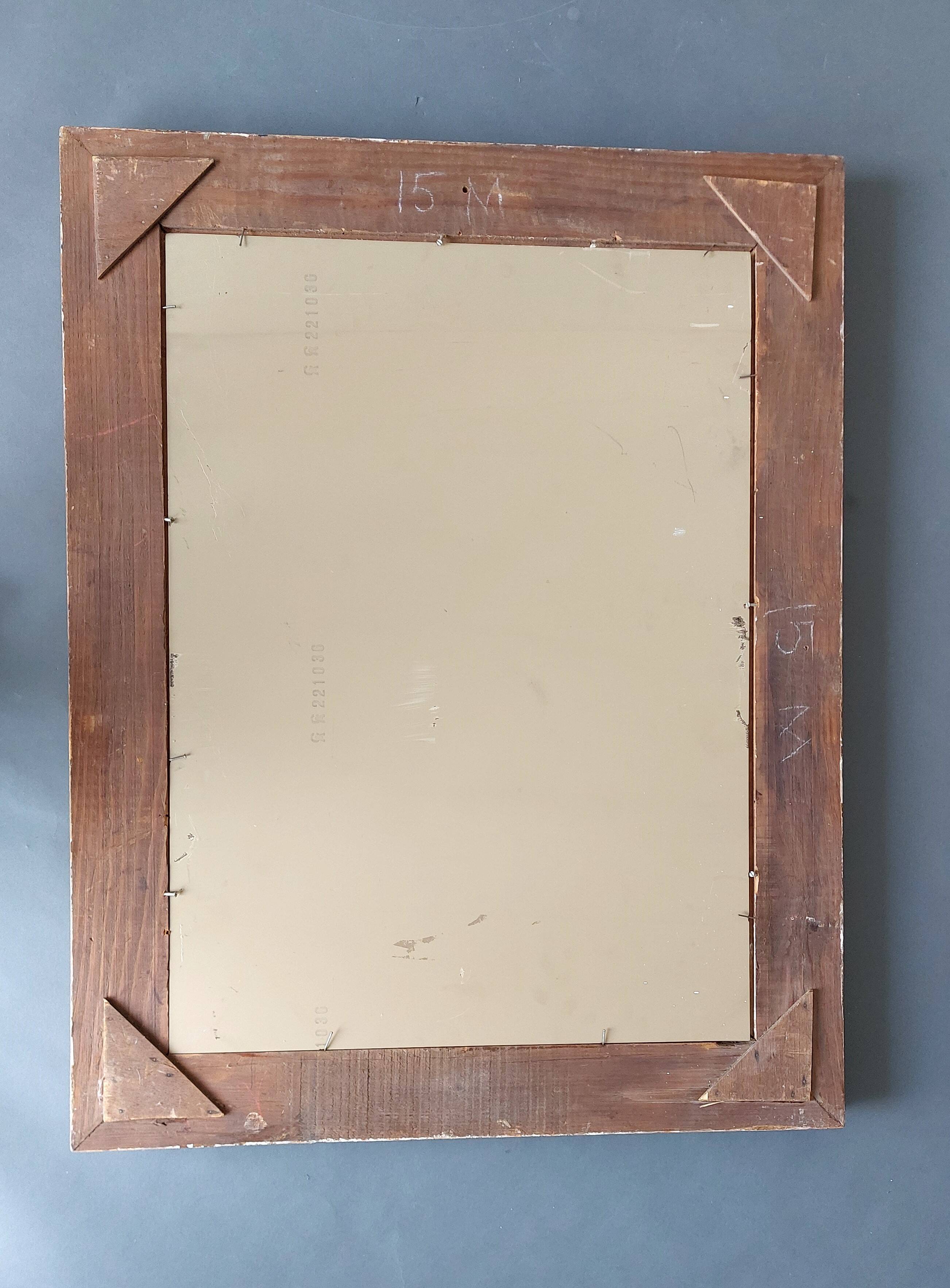 Large Montparnasse rocaille style frame in carved wood mounted in mirror.