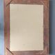 Large Montparnasse rocaille style frame in carved wood mounted in mirror.