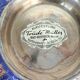 Vintage brass bowl with peacock motif, painted enamel, scalloped edge on a pedestal.