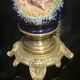 Pair of candlesticks. Bronze, brass, porcelain.