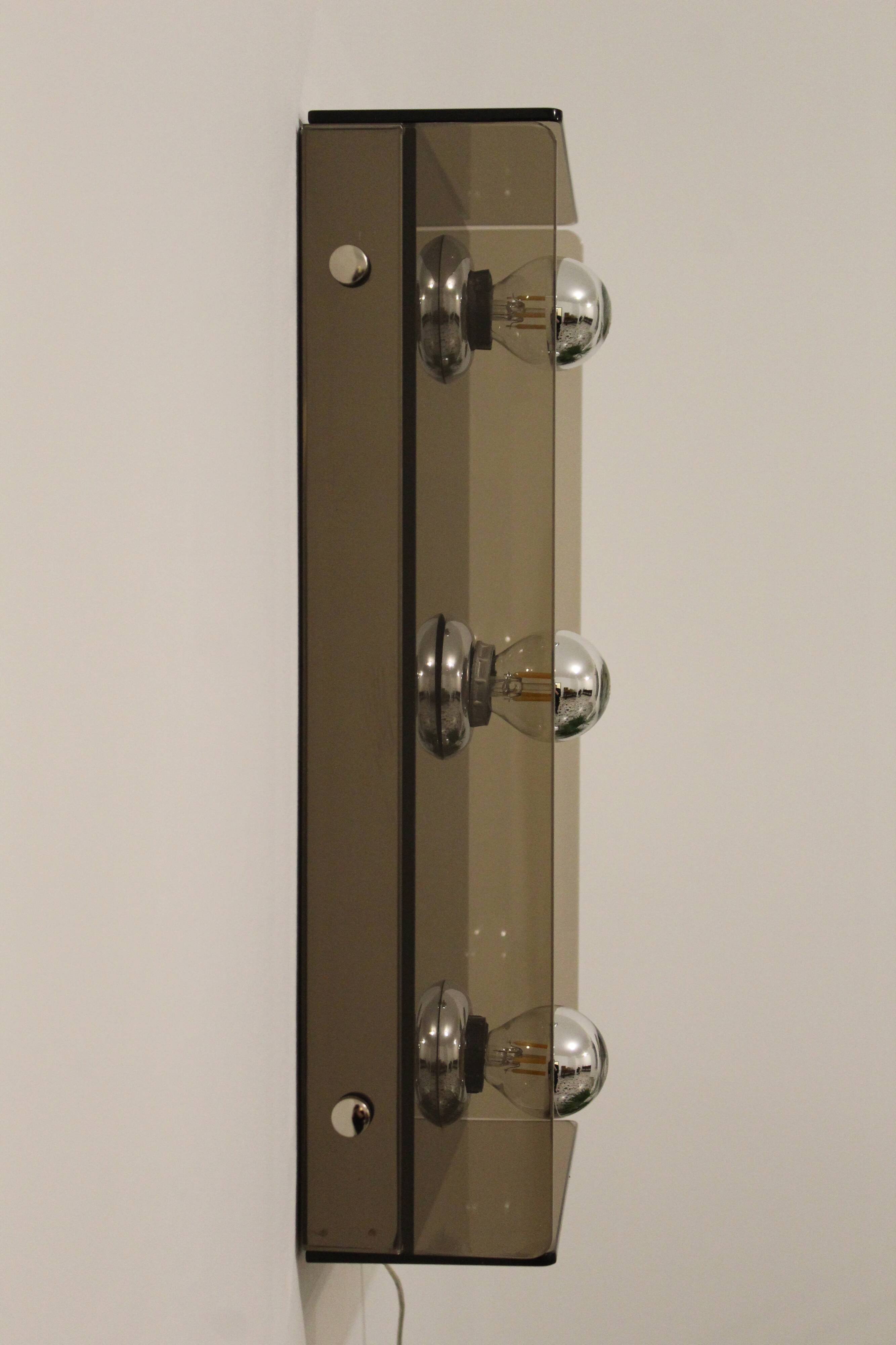 Pair of smoked glass wall lamps, mirrored bottom, Italy 70s