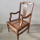 Fauteuil canné en bois naturel