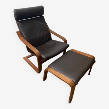 Leather armchair with footrest