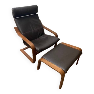 Leather armchair with footrest