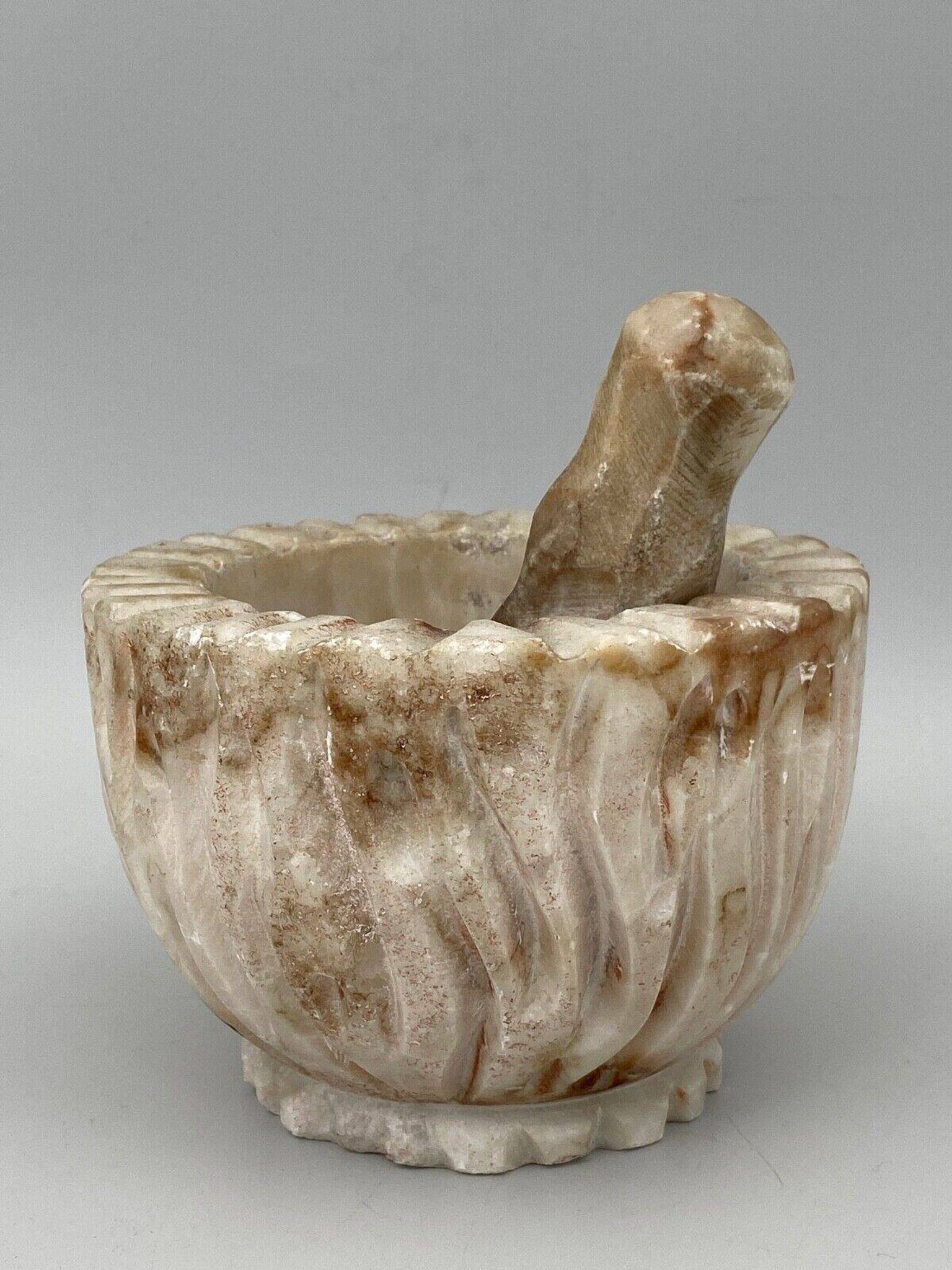 Pharmacy mortar and pestle in alabaster China man's face