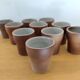 Stoneware cups – Armor stoneware set of 10 and an 11th French stoneware cup.