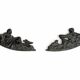 Pair of neoclassical fronton wall sconces in cast iron, elongated figures, 19th century.