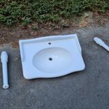 White ceramic wall washbasin with 2 ceramic legs