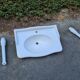 White ceramic wall washbasin with 2 ceramic legs