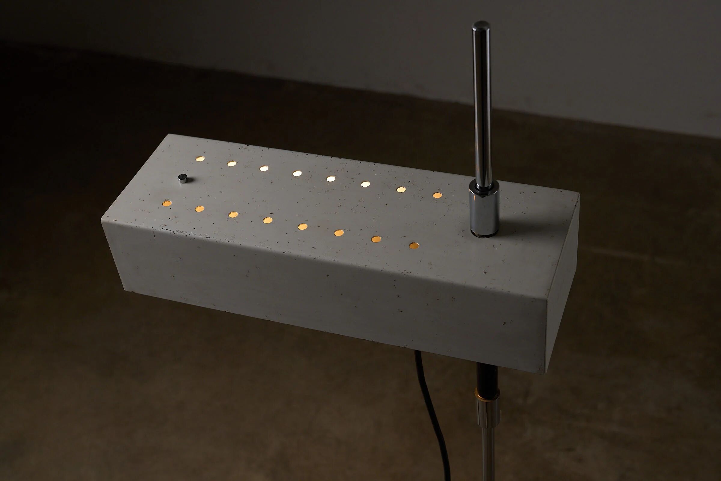 Adjustable perforated shade floor lamp