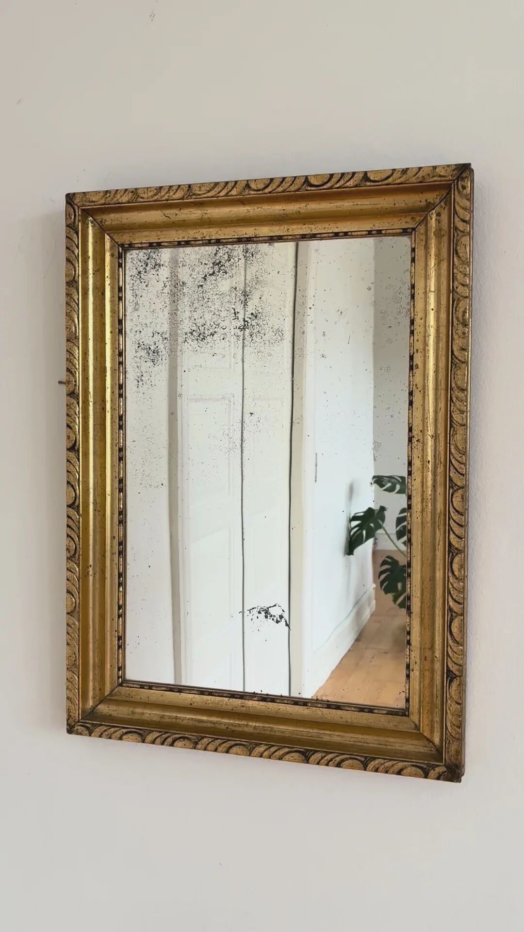 Antique French giltwood wall mirror in gold