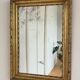 Antique French giltwood wall mirror in gold