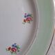 Flat earthenware plates with gilded edges