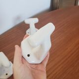 Trio of white porcelain hooks