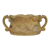 Art Nouveau jardinière with bas-reliefs in terracotta.