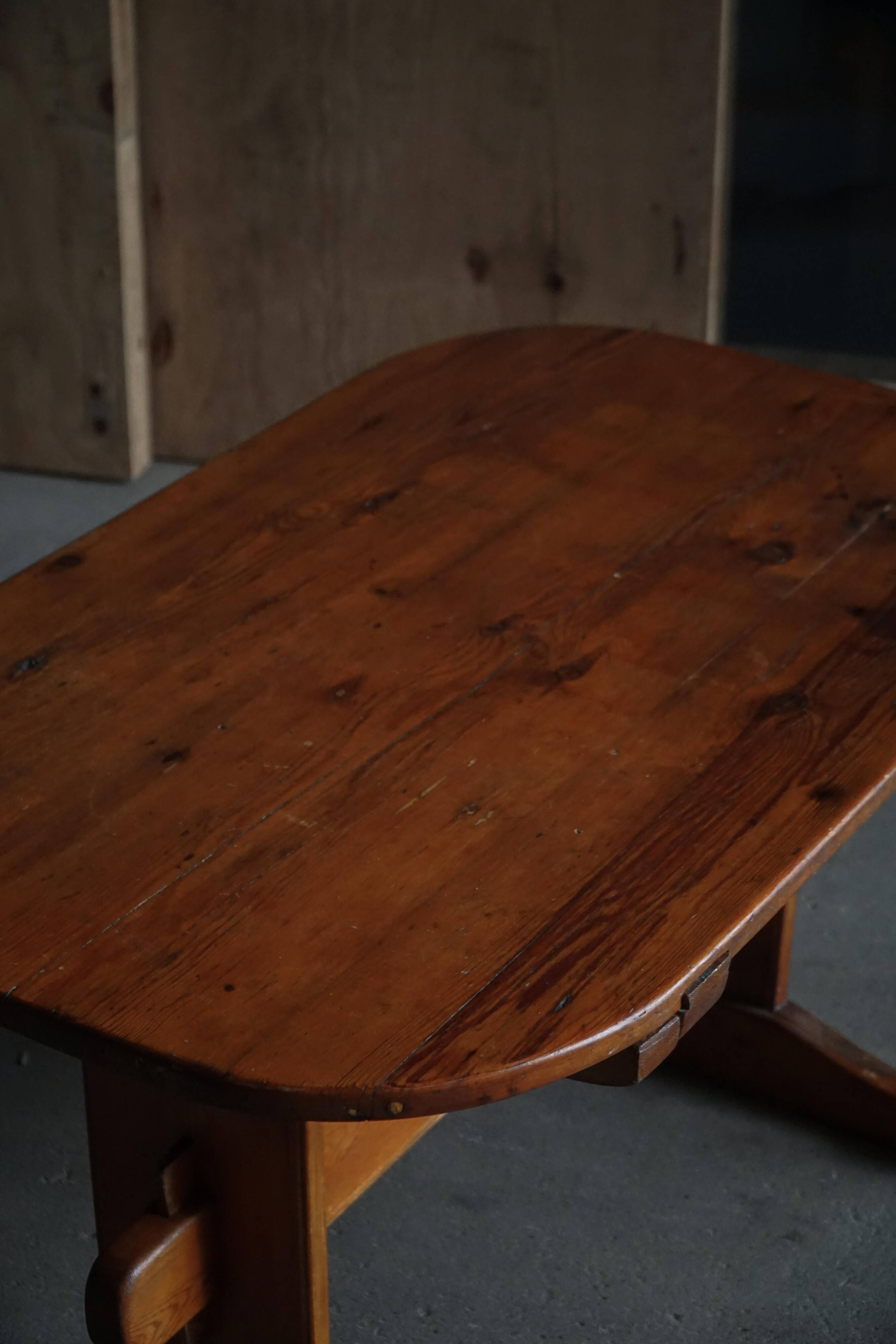 Primitive Swedish oval dining table in pine, early 20th century.