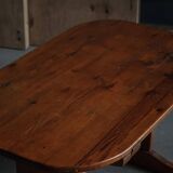 Primitive Swedish oval dining table in pine, early 20th century.