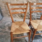 Set of 4 mid-century Italian dining chairs with woven seats, circa 1950–1970.