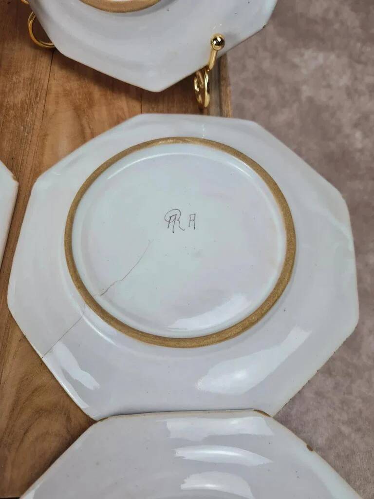 Set of 12 small antique plates by Alfred Renoleau, different designs.